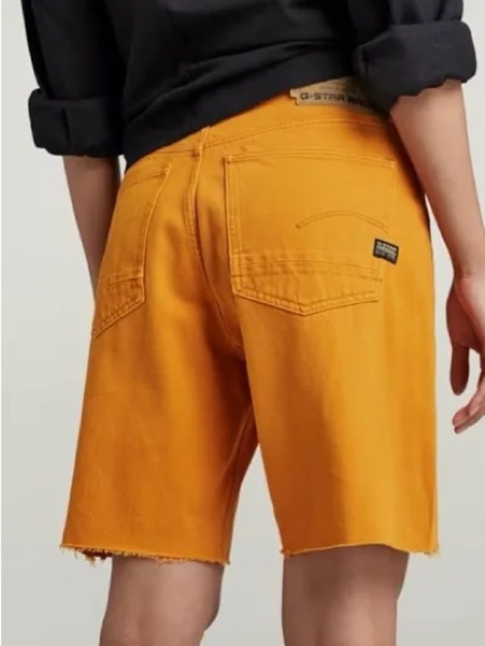 G-Star Raw Type 89 bermuda shorts in a yellow gold color with a raw cut hem